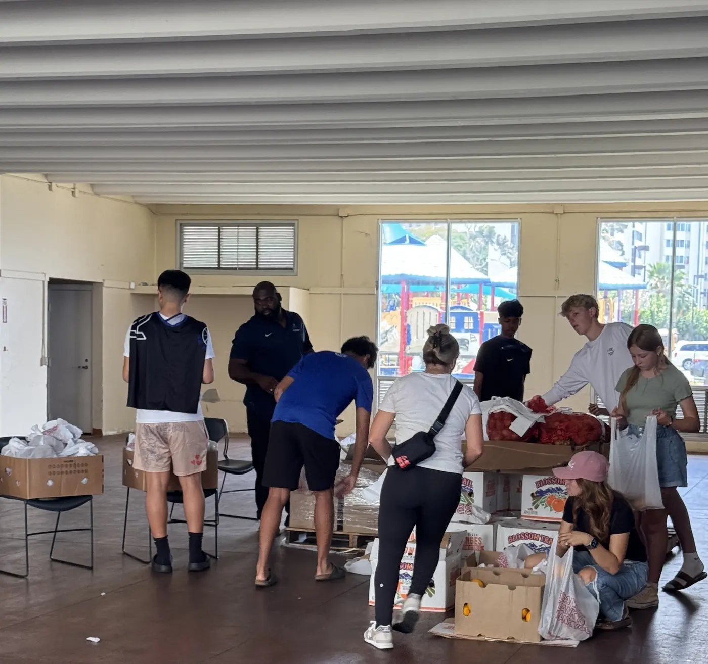 Volunteers sorting and preparing donated food during a community service project