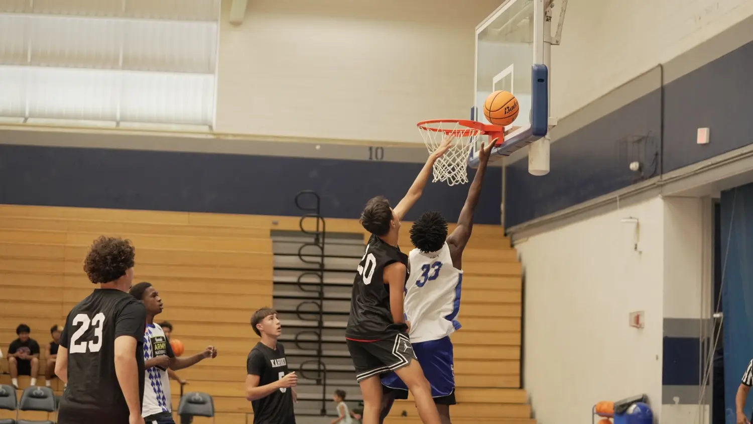 Varsity: Moanalua Fall League players contesting a shot at the basket