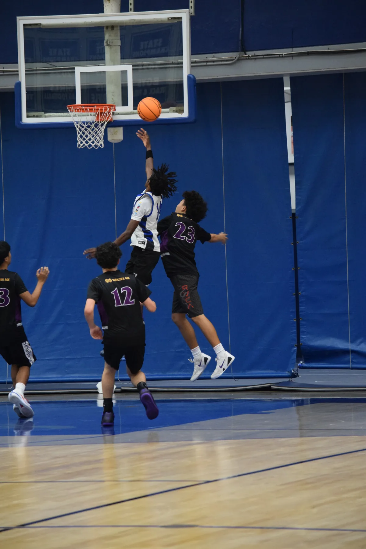 Junior Varsity: Player attacking the basket