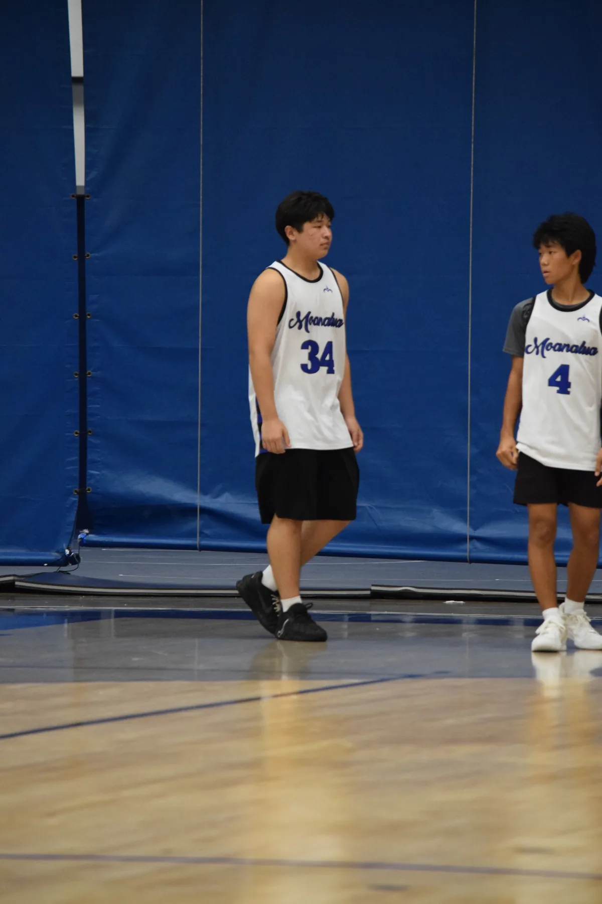 Junior Varsity: Two players walking together on the court